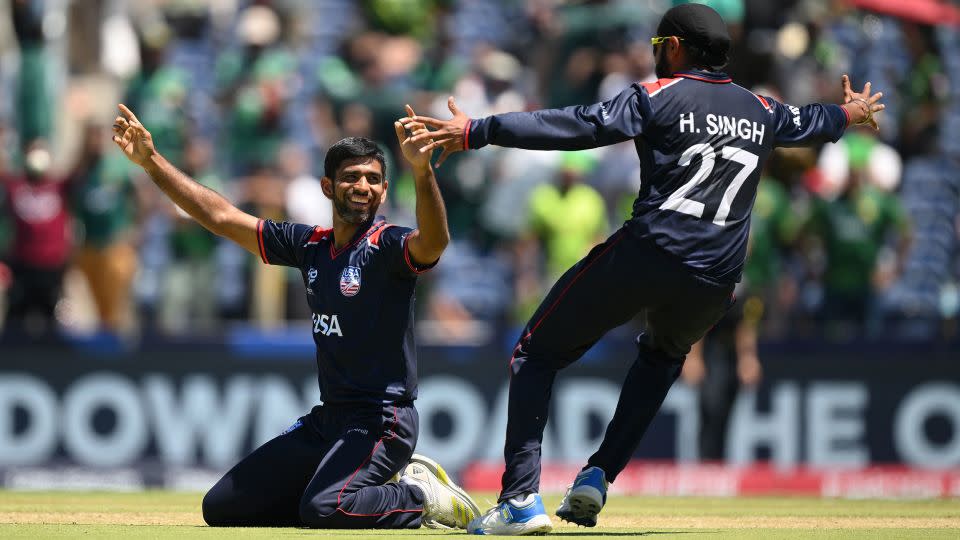 Saurabh Netravalkar (left) bowled the decisive Super Over to help the USA to its famous victory over Pakistan at the Men's T20 Cricket World Cup. - Matt Roberts/ICC/Getty Images