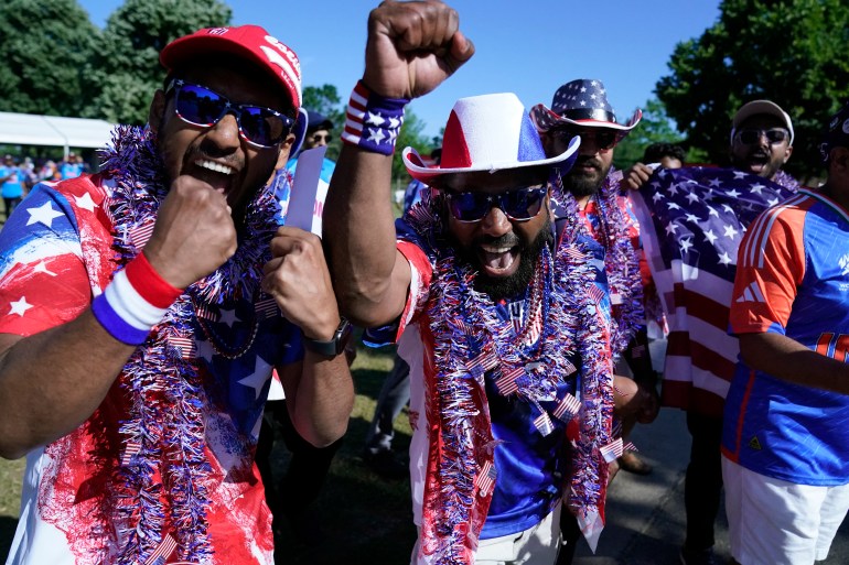 USA fans celebrate before the ICC men's Twenty20 World Cup 2024 group A cricket match between the USA and India outside Nassau County International Cricket Stadium in East Meadow, New York on June 12, 2024. (Photo by TIMOTHY A. CLARY / AFP)