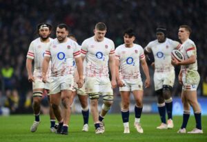 England’s Coach Mitchell Celebrates a Thrilling Grand Slam Victory!